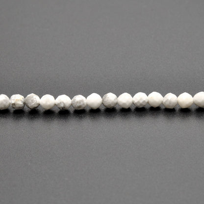 White howlite round beads 12.5 inch strand overhead flat lay
