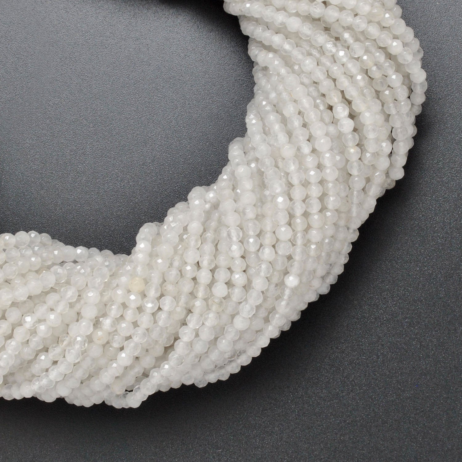 White quartz faceted round beads 15 inch strand overhead flat lay