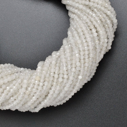 White quartz faceted round beads 15 inch strand overhead flat lay