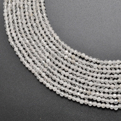 Natural white quartz round faceted beads 15 inch strand - front view