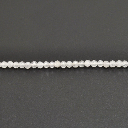 Natural white quartz round faceted beads Jaipur wholesale scale reference