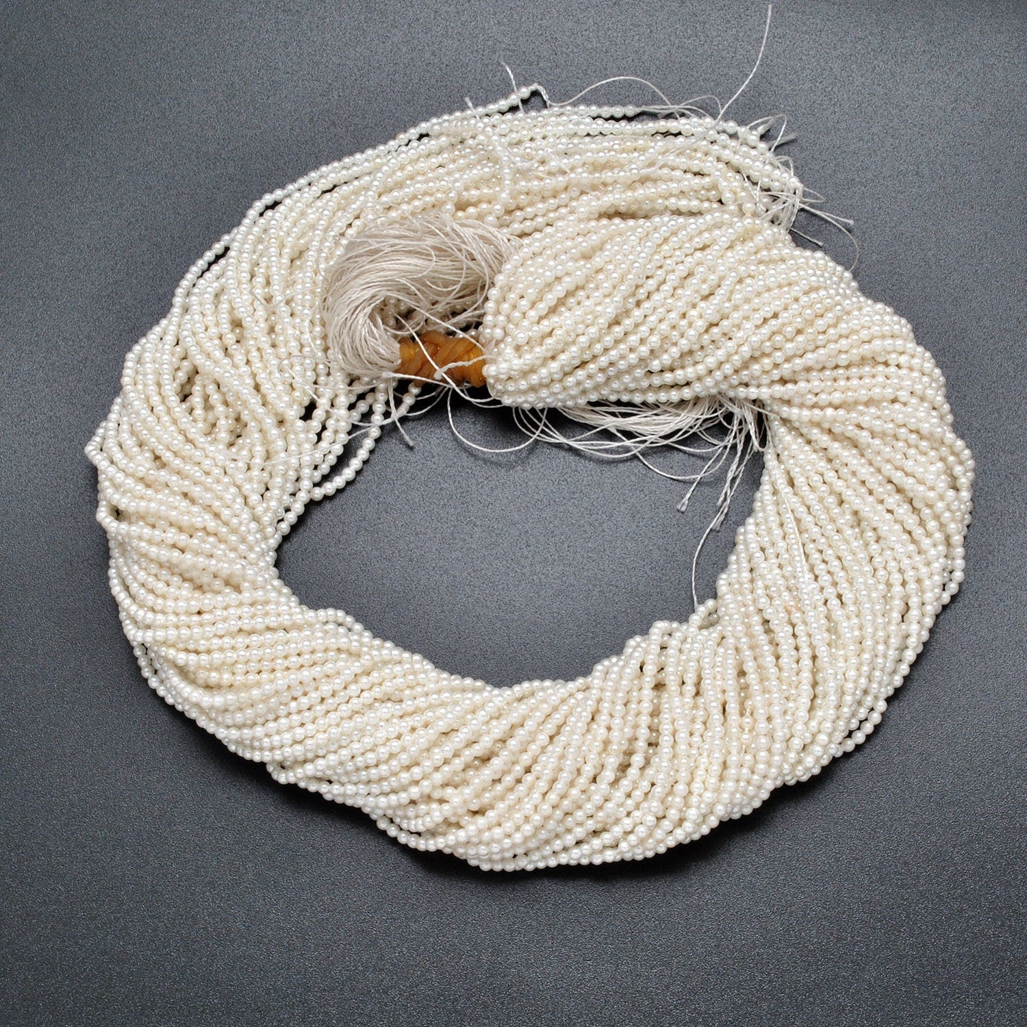 White shell pearl round beads 16 inch strand overhead flat lay