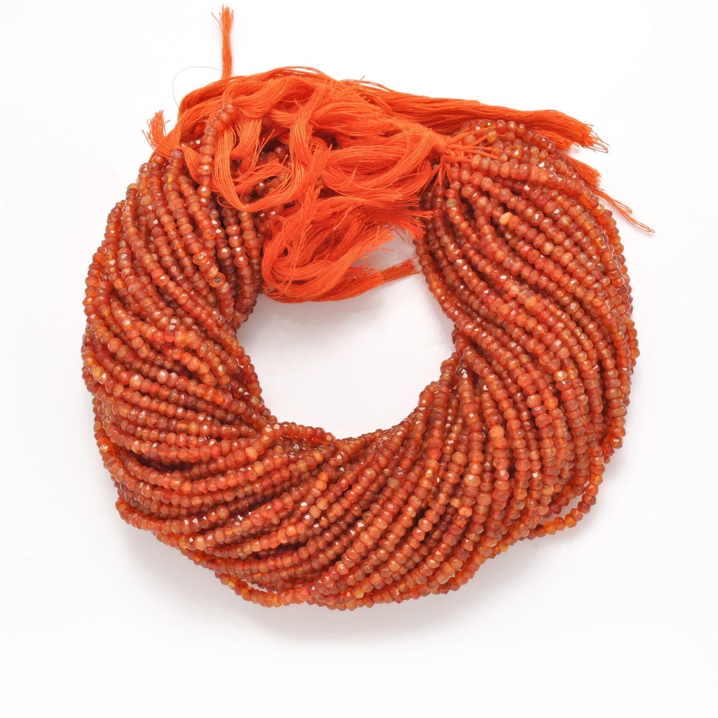 Orange carnelian faceted rondelle beads - close-up warm orange glow