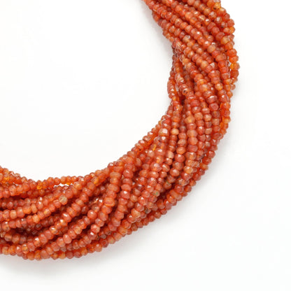 Orange carnelian rondelle beads for boho jewelry - side profile
