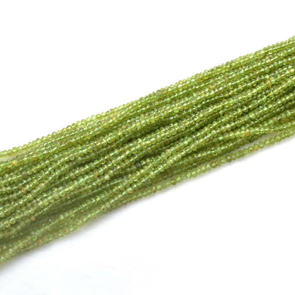 Peridot faceted rondelle beads - close-up vivid lime-green color