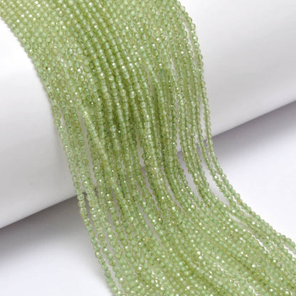 Peridot round faceted beads - close-up vivid lime-green sparkle