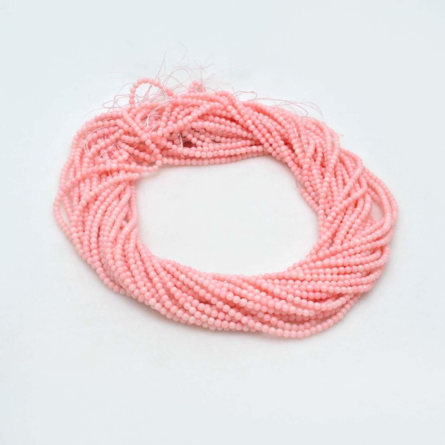 Pink coral round beads close-up peachy-pink warm colour