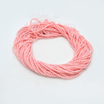 Pink coral round beads close-up peachy-pink warm colour