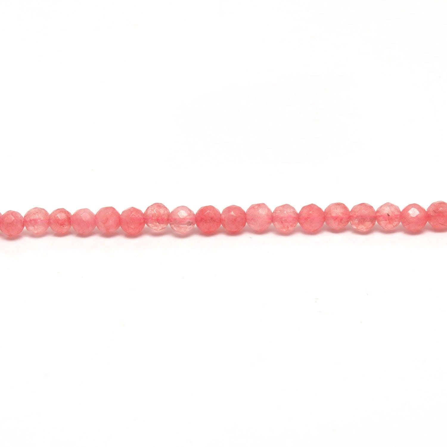 Pink quartz petite faceted round beads scattered loose view Jaipur