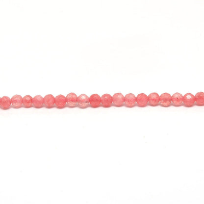 Pink quartz petite faceted round beads scattered loose view Jaipur
