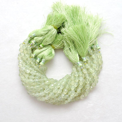 Prehnite teardrop beads - close-up translucent lime-green faceted