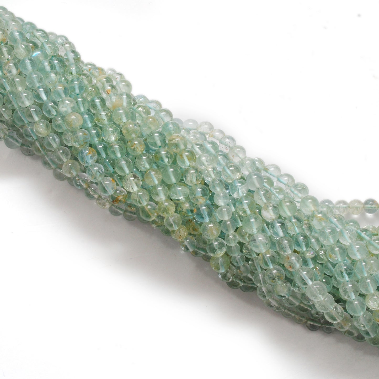 Premium aquamarine 6-6.5mm beads 15 inch strand overhead flat lay