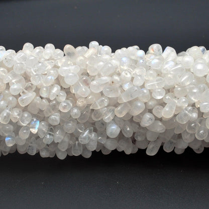 Rainbow moonstone plain drop beads Jaipur wholesale scale reference