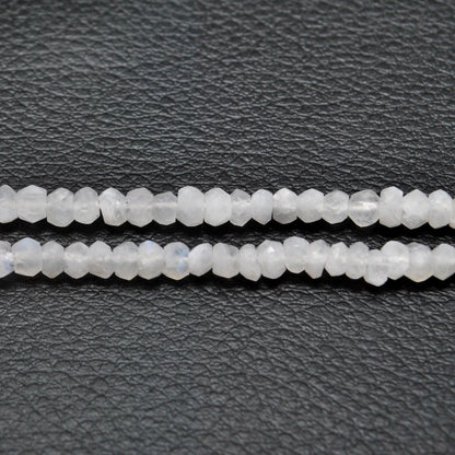 Rainbow moonstone rondelle beads - close-up electric blue flash