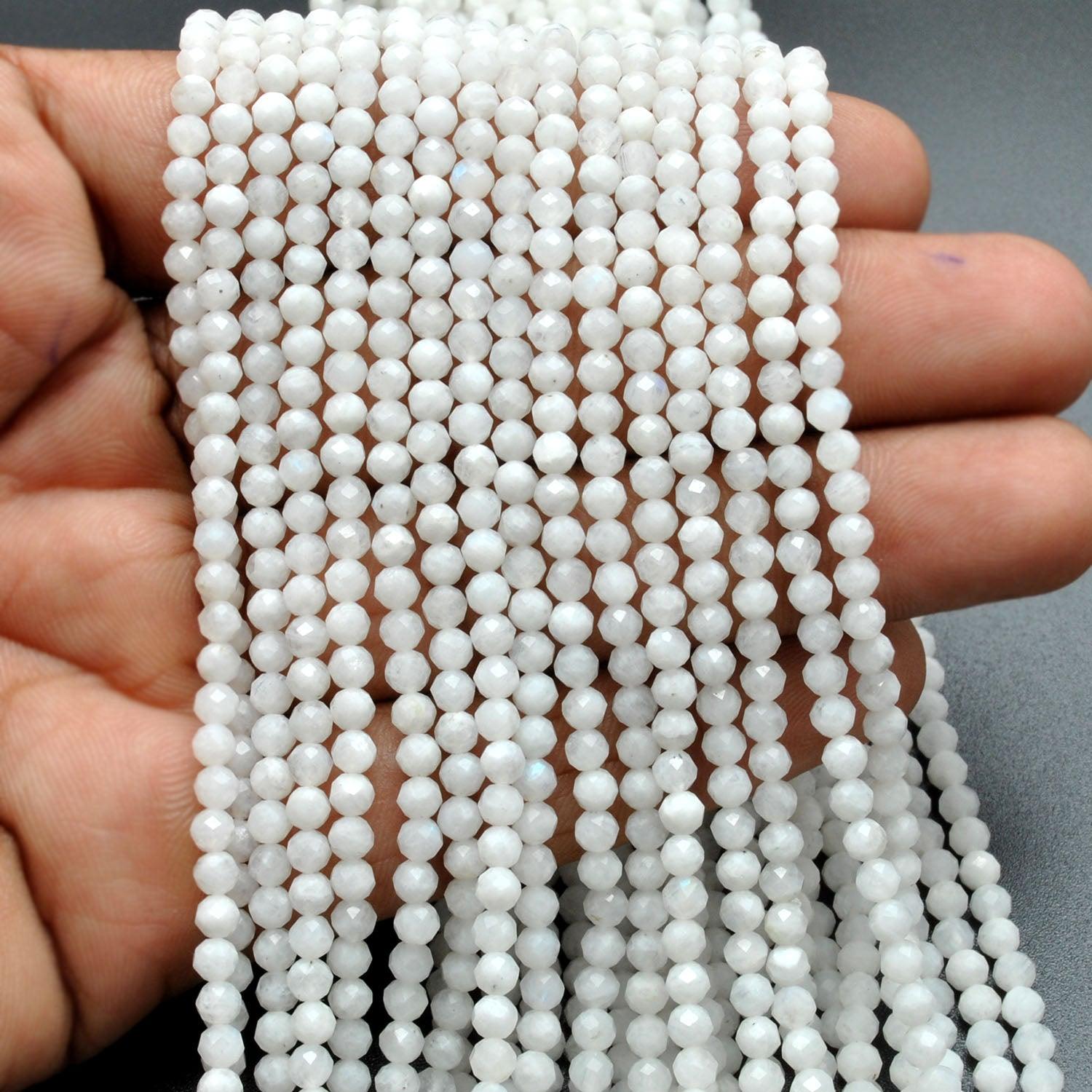 Rainbow moonstone round beads scattered - blue spectral flash