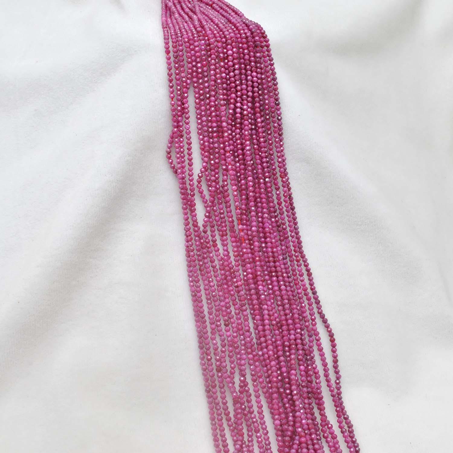 Red moonstone faceted beads scattered loose - rare peach-red view