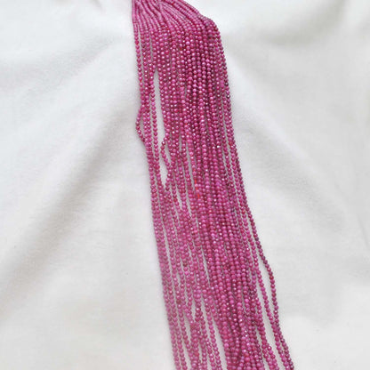 Red moonstone faceted beads scattered loose - rare peach-red view