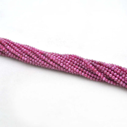 Red moonstone faceted round beads close-up peach-red inner glow