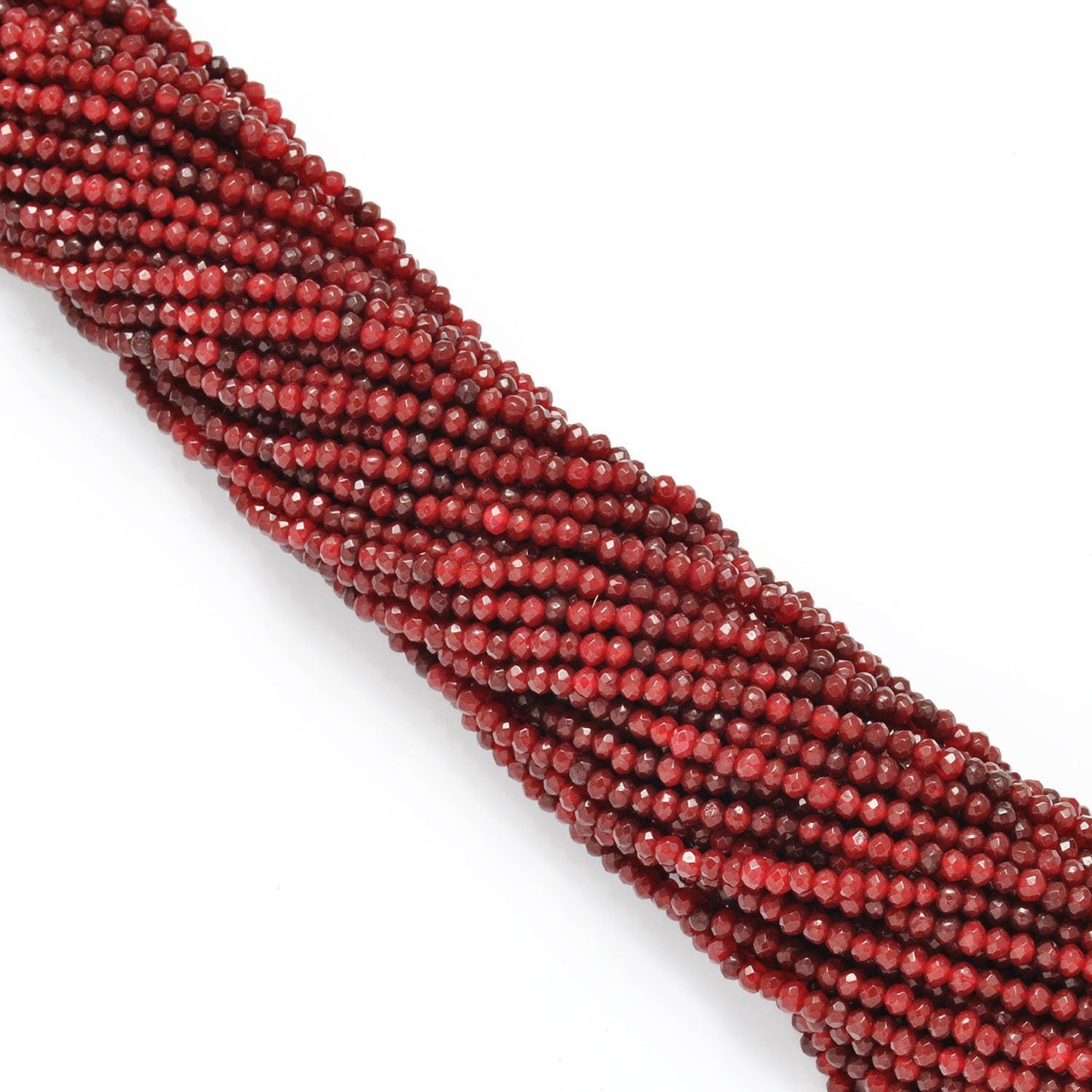 Red ruby faceted rondelle beads scattered loose view Jaipur