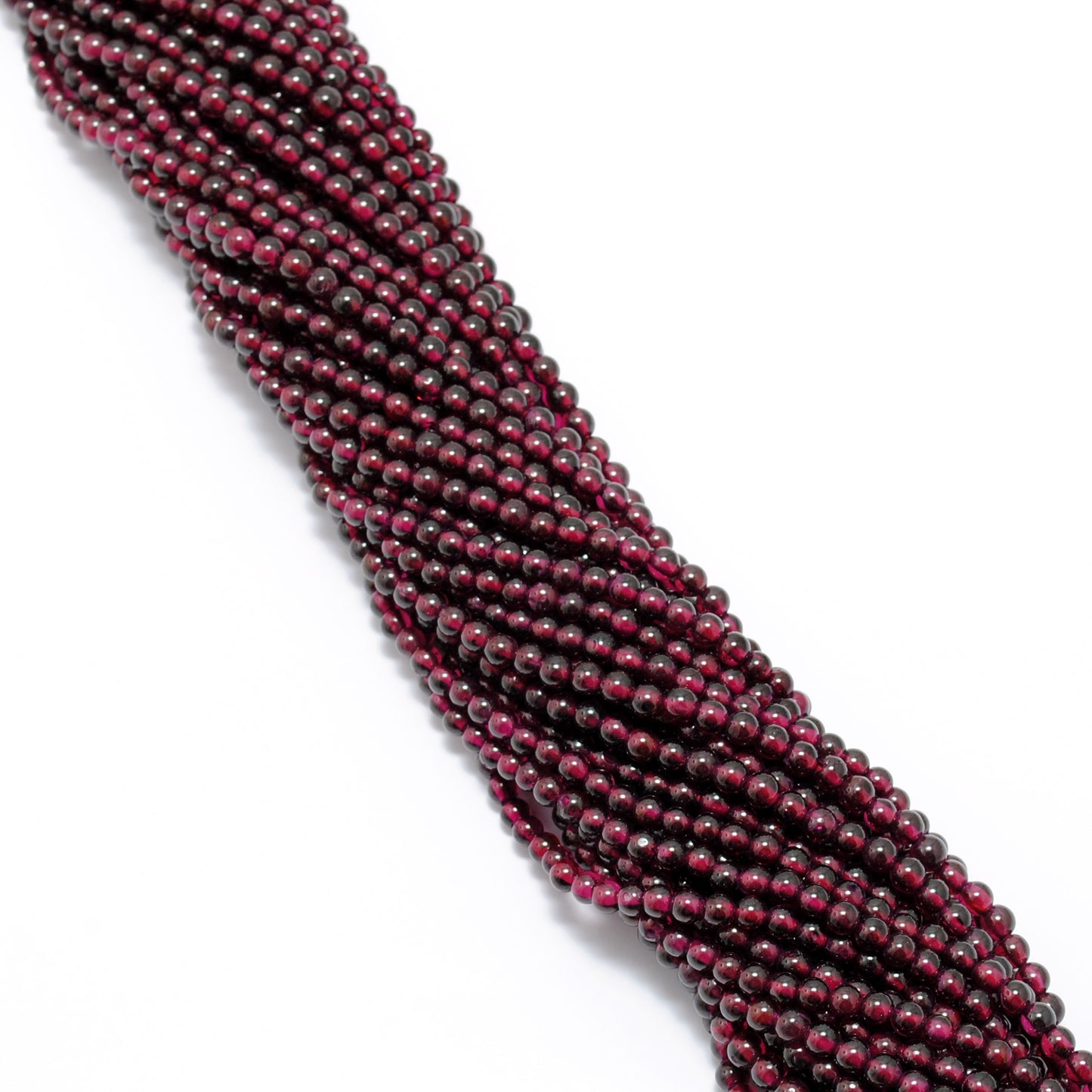 Rhodolite garnet 5.5-6mm beads detail shot - pink-red colour