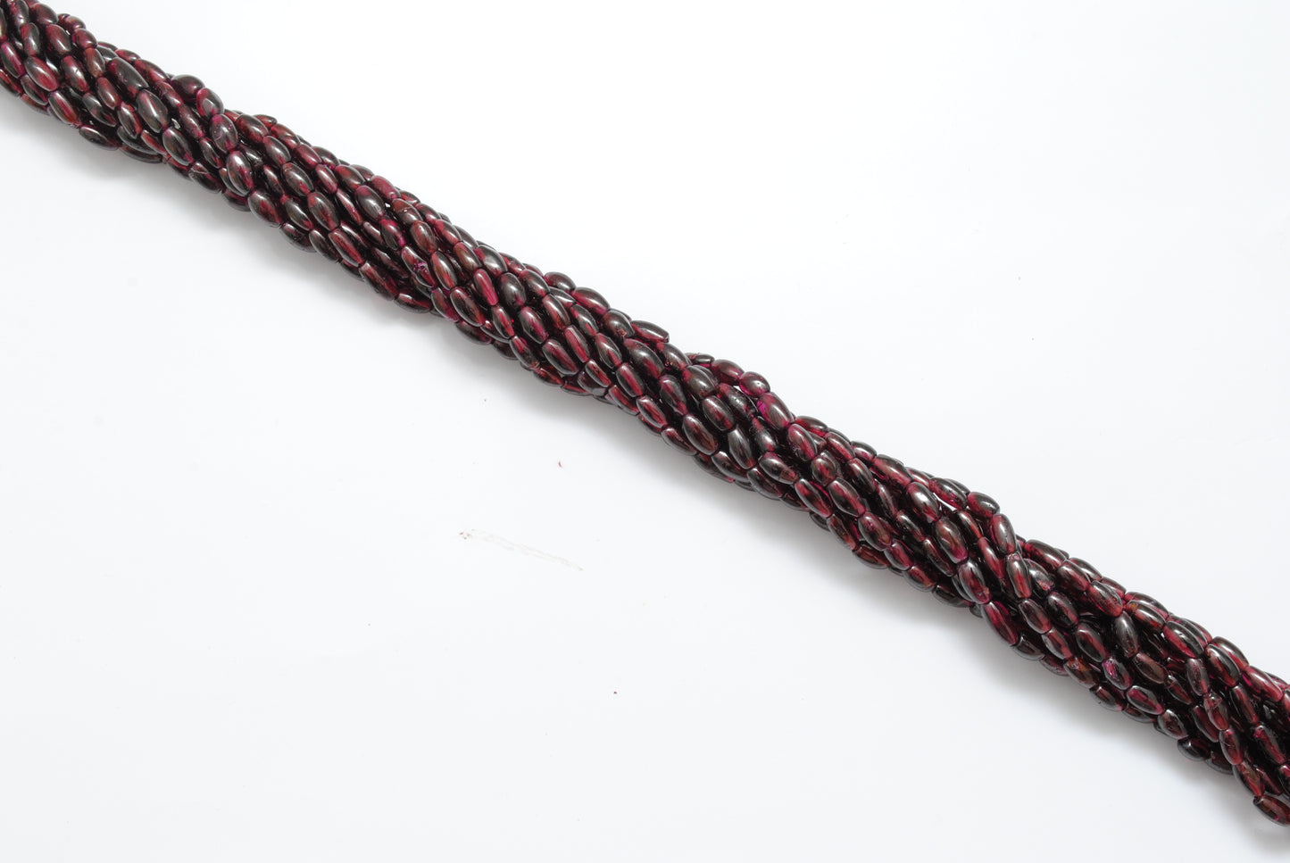 Rhodolite garnet drum beads scattered loose mixed sizes view
