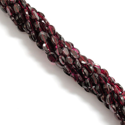 Rhodolite garnet faceted oval beads scattered loose 5x7-6x8mm view