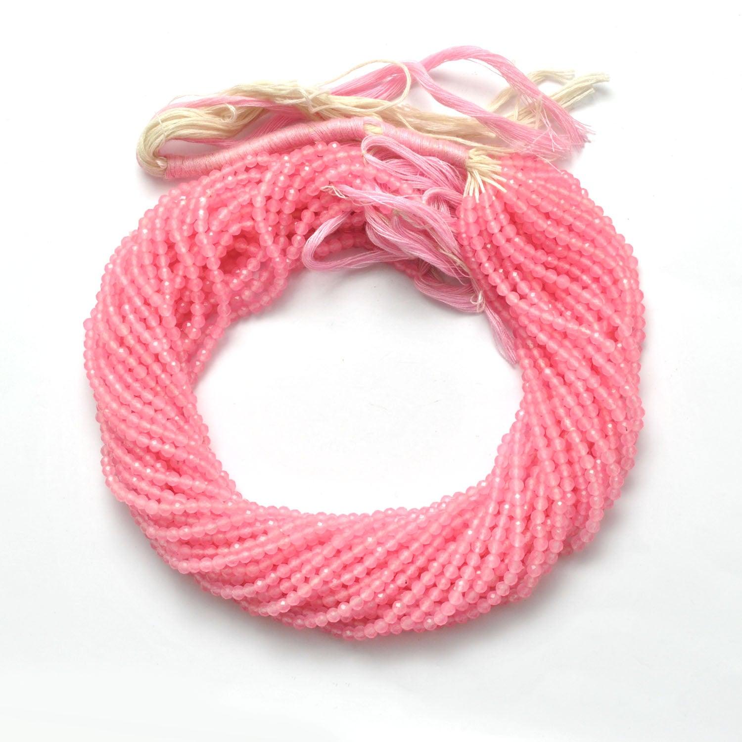 Rose quartz faceted round beads close-up blush-pink sparkle