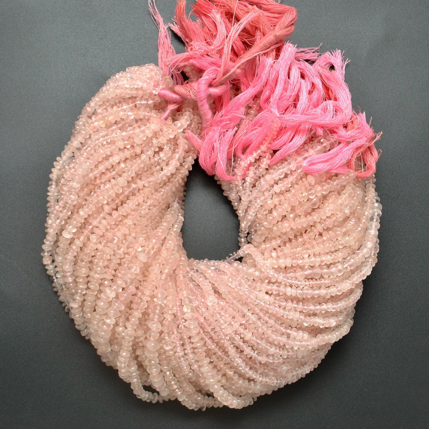 Rose quartz button beads close-up soft blush-pink colour