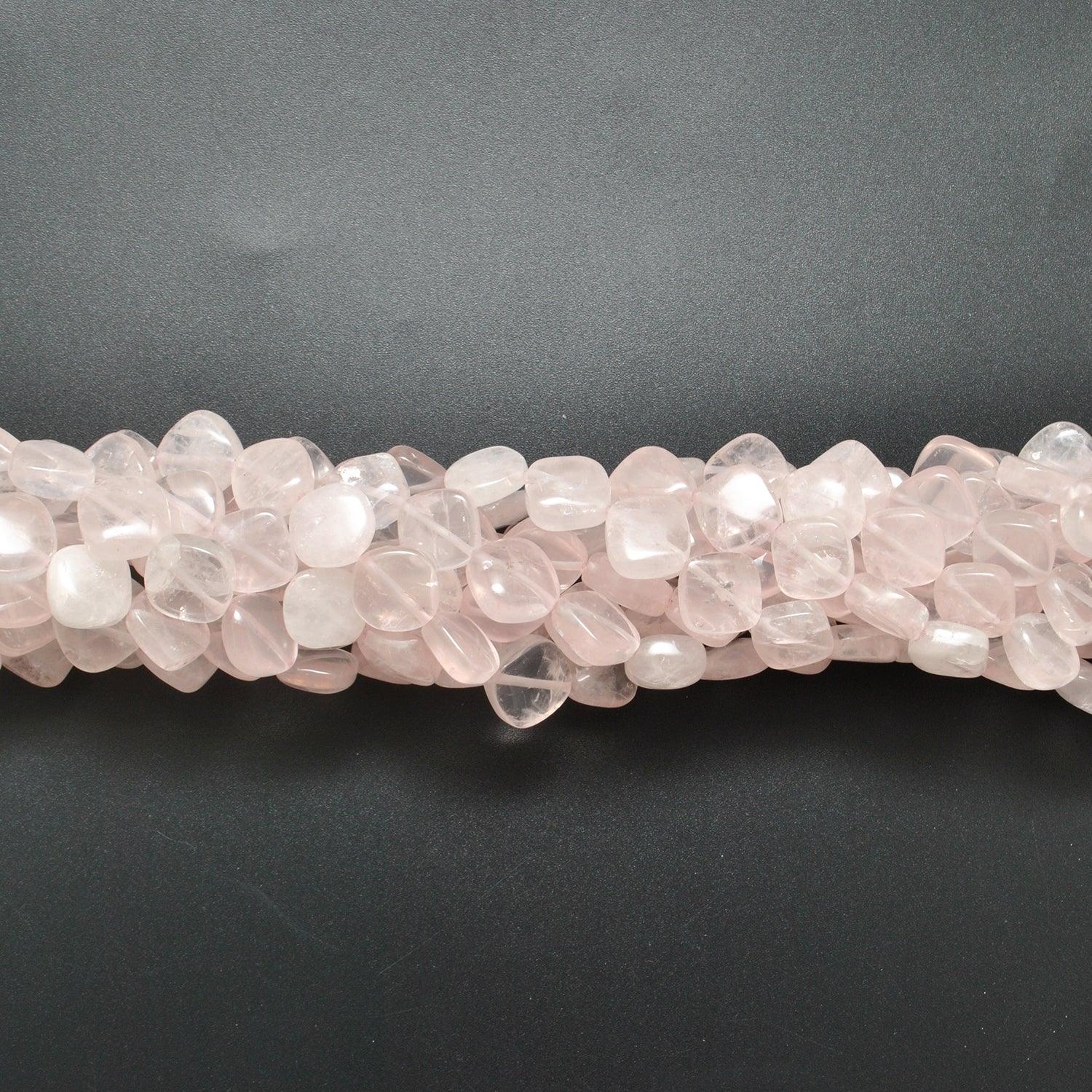 Rose quartz cushion beads scattered loose - cushion shape view