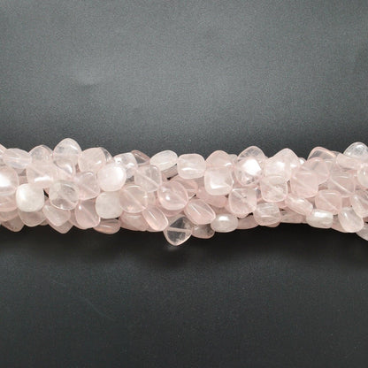 Rose quartz cushion beads scattered loose - cushion shape view