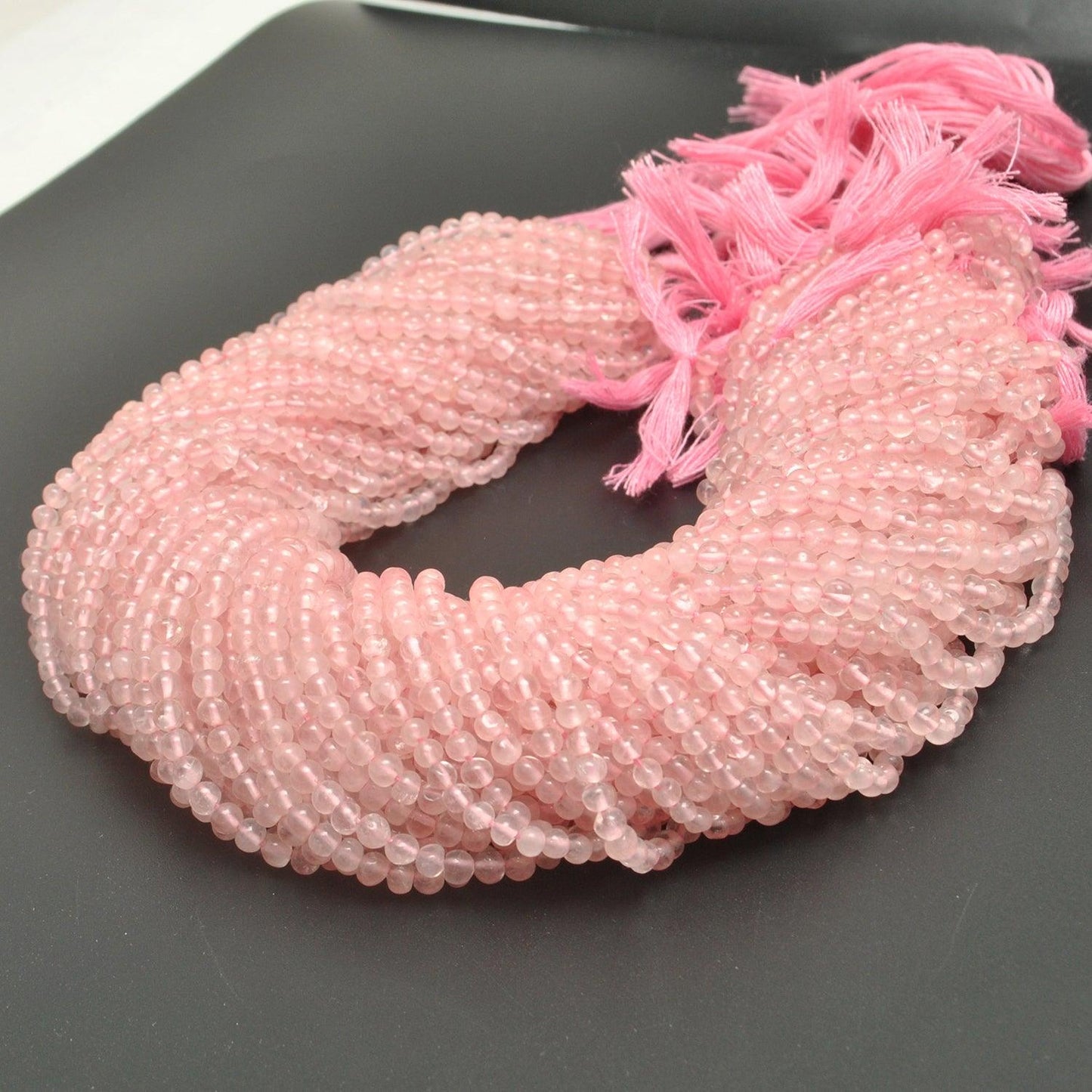 Rose quartz round beads Jaipur wholesale - scale reference