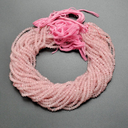 Rose quartz rondelle faceted beads close-up soft pink sparkle