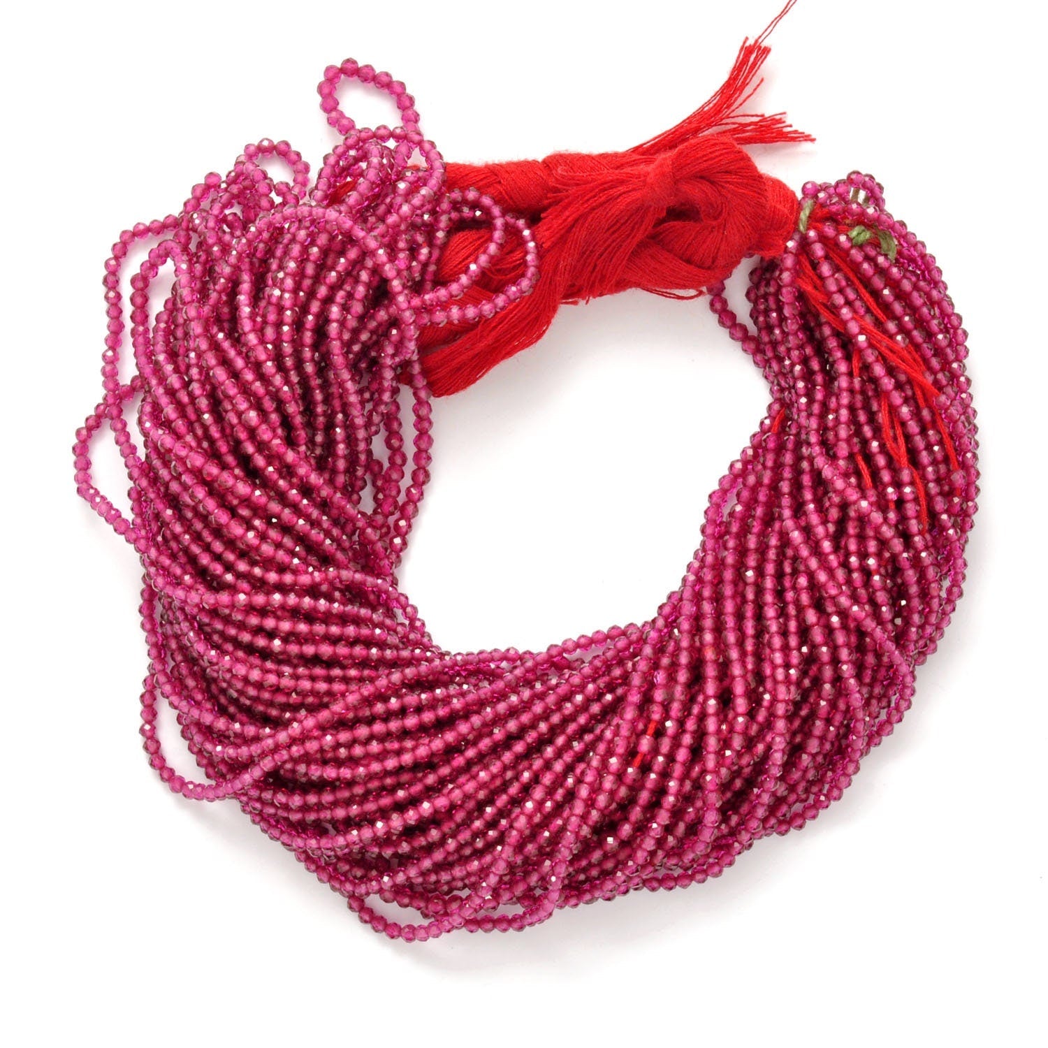 Ruby corundum faceted round beads close-up deep red corundum colour