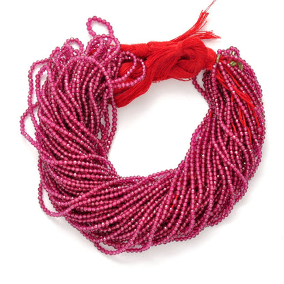 Ruby corundum faceted round beads close-up deep red corundum colour