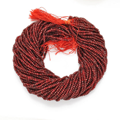 Ruby faceted rondelle beads close-up rich deep-red colour