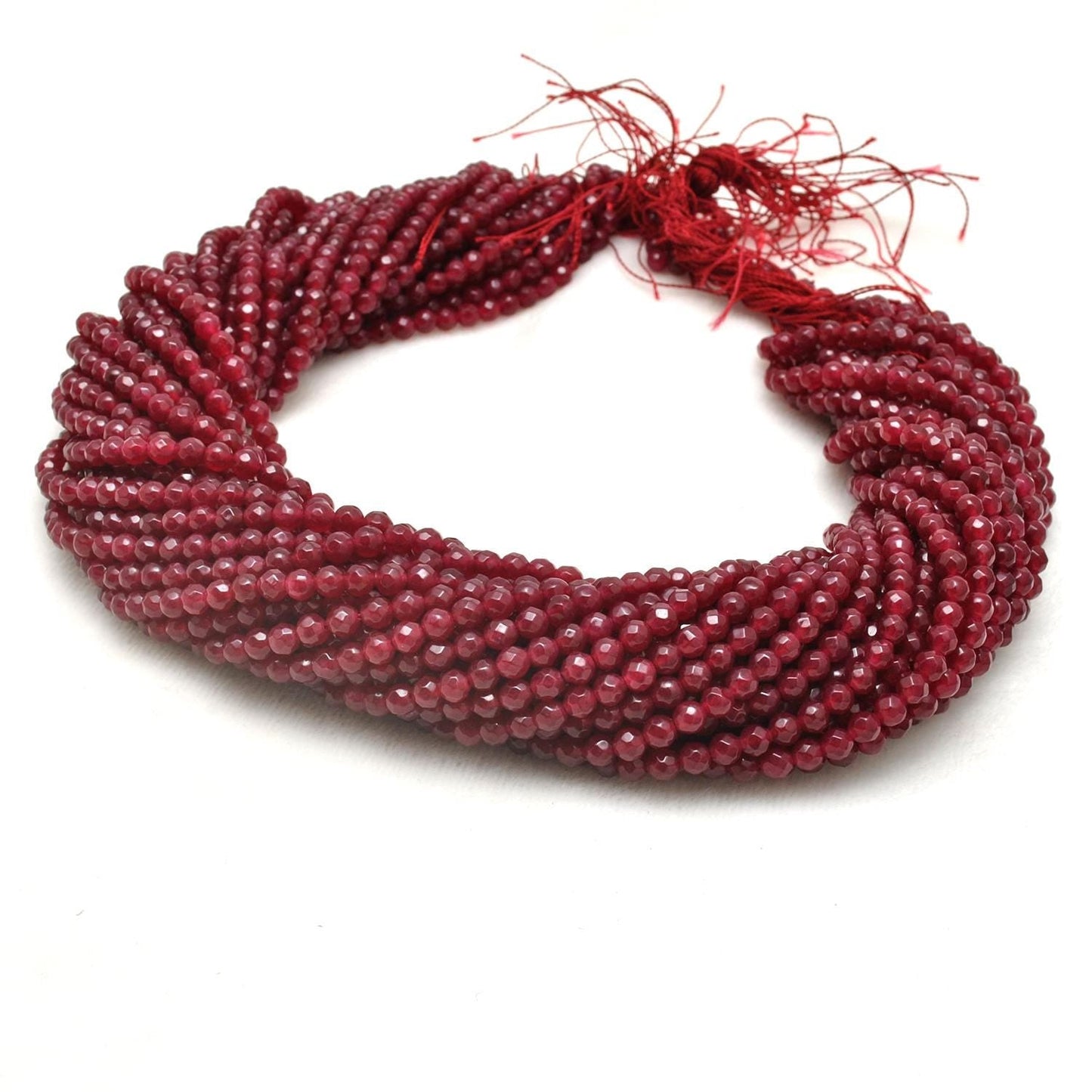 Ruby quartz faceted round beads scattered loose view