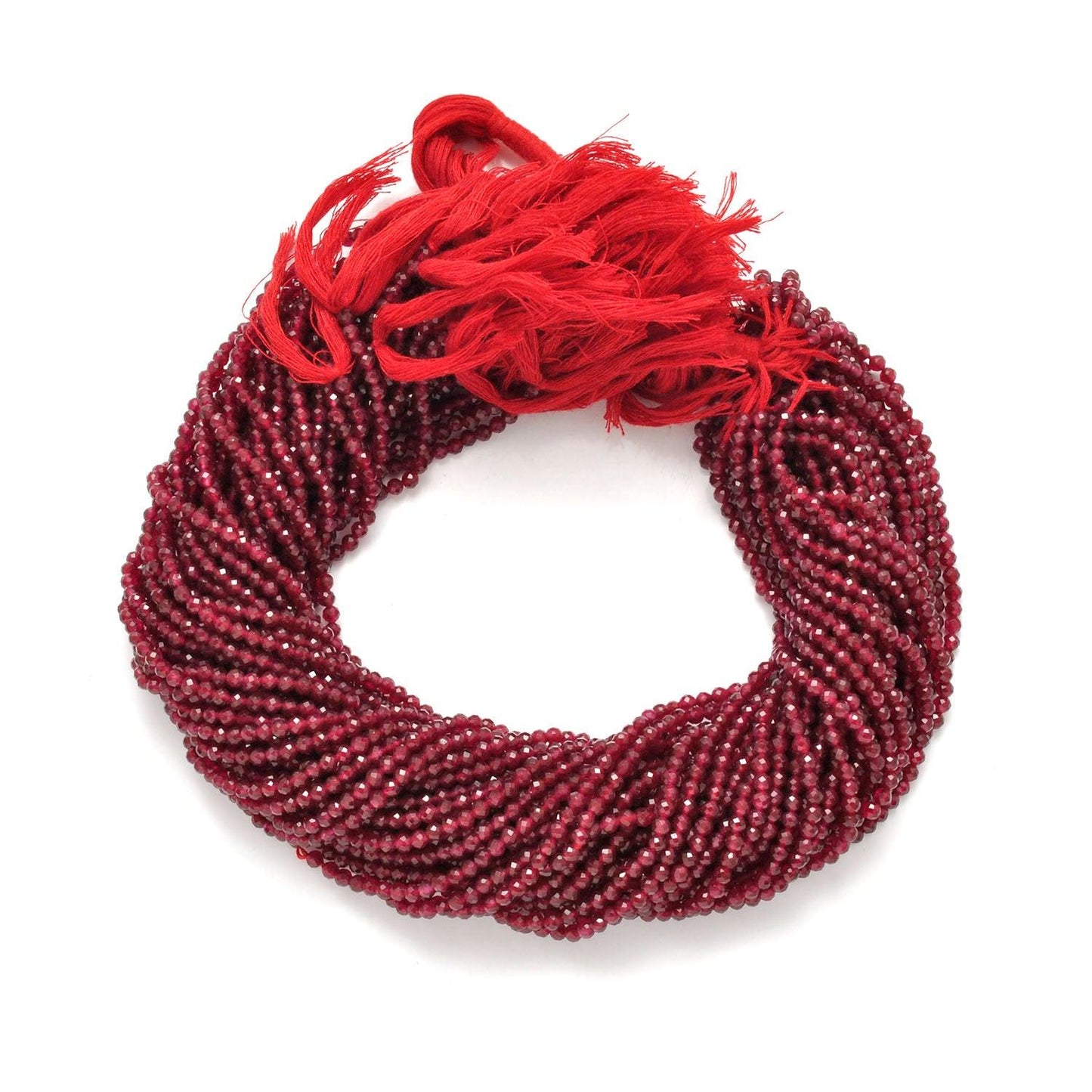 Ruby quartz round faceted beads scattered loose - deep red view