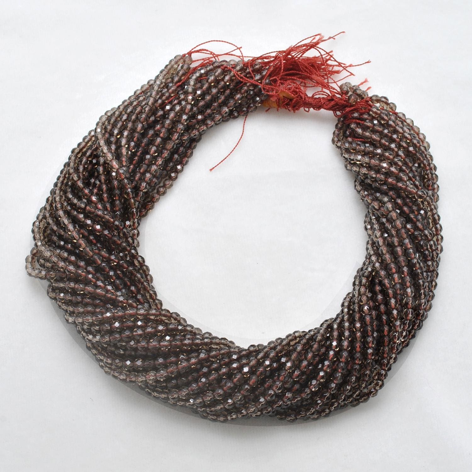 Smoky quartz round faceted beads close-up earthy brown-grey colour
