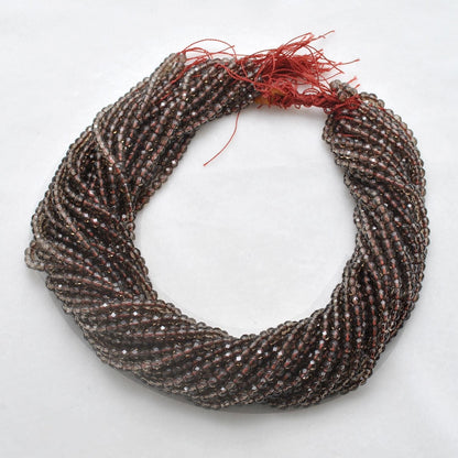 Smoky quartz round faceted beads close-up earthy brown-grey colour