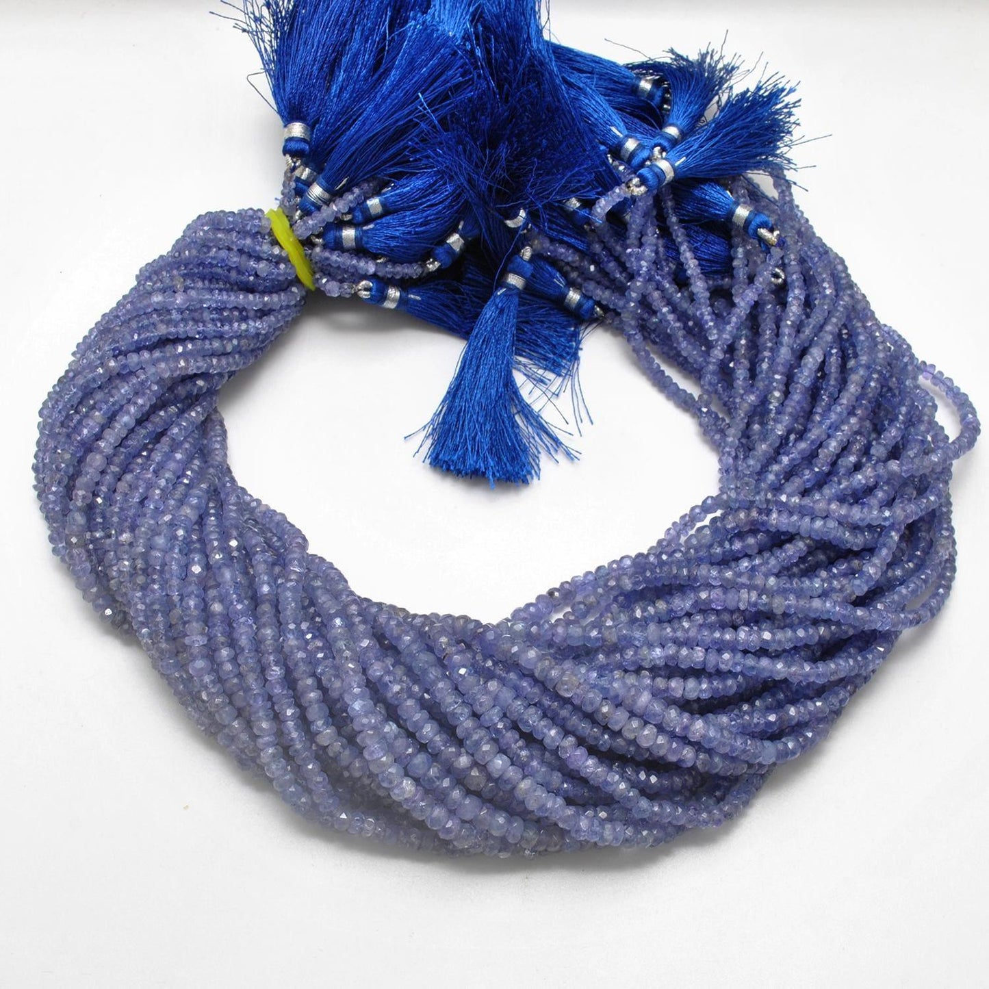 Tanzanite rondelle faceted beads close-up violet-blue colour