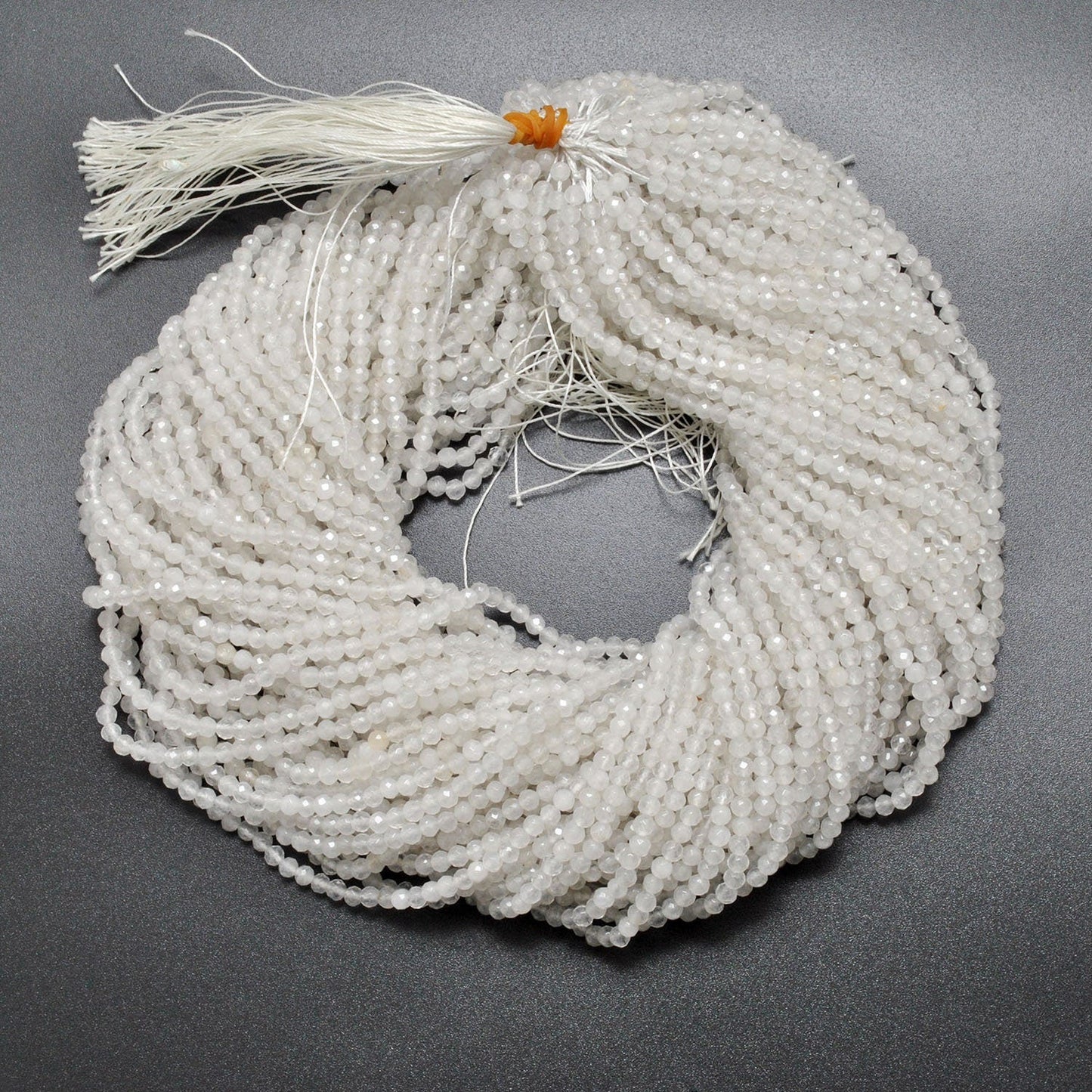White quartz round faceted beads close-up crisp clear sparkle