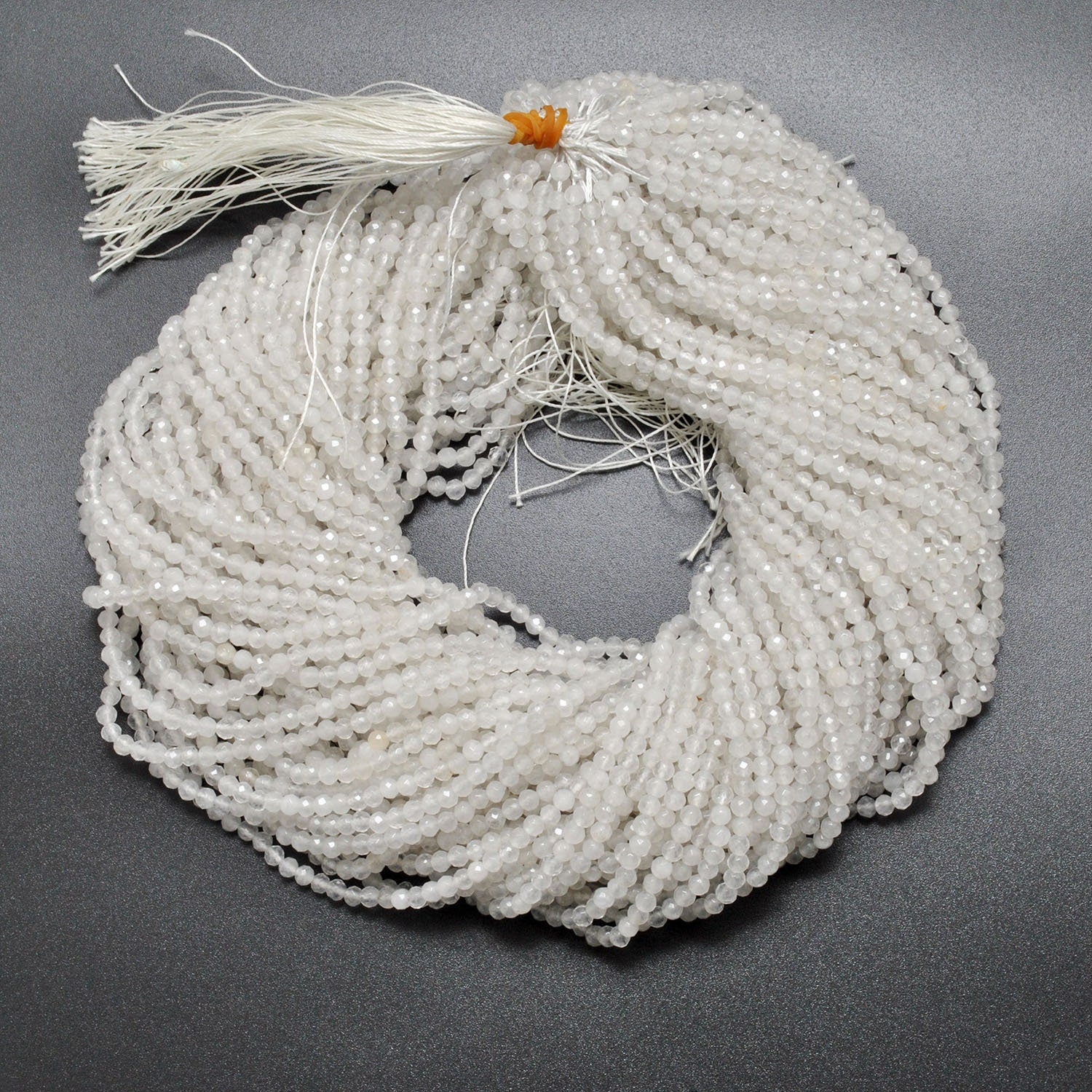 White quartz round faceted beads close-up crisp clear sparkle