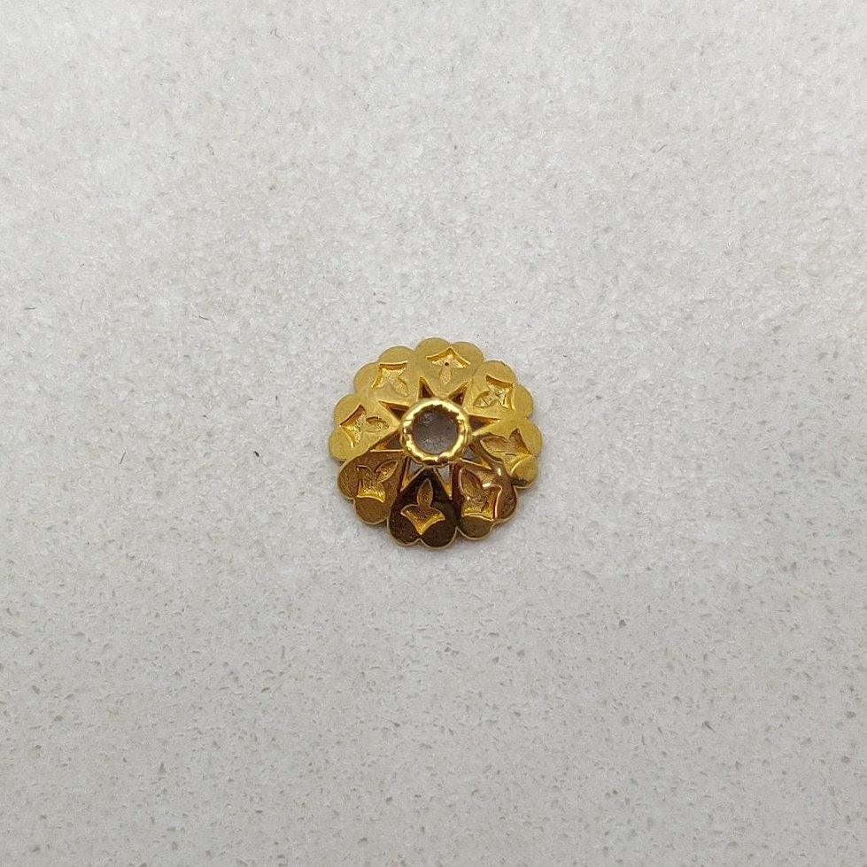 Yellow 18K gold end cap styled on necklace termination